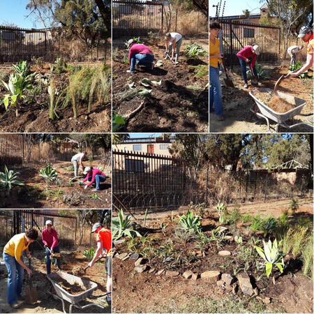 Volunteers help making garden
